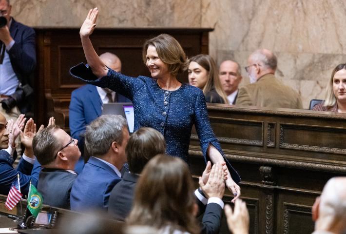 Commissioner Kuderer waving to crowd in legislature